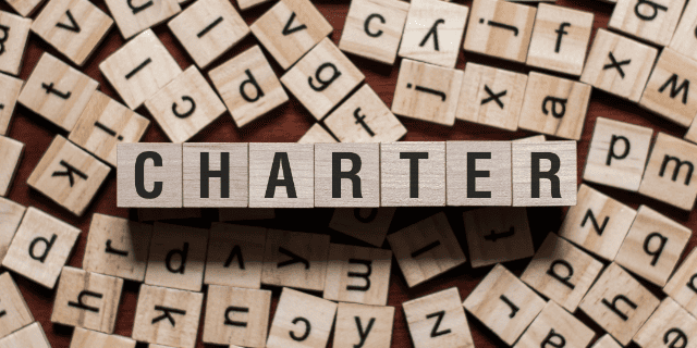 het-woord-charter-geschreven-met-blokjes Betekenis van charter